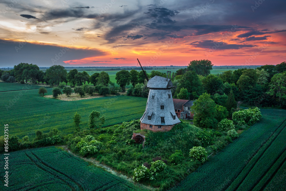 Fototapeta premium Sunset at an old windmill in the countryside, Poland