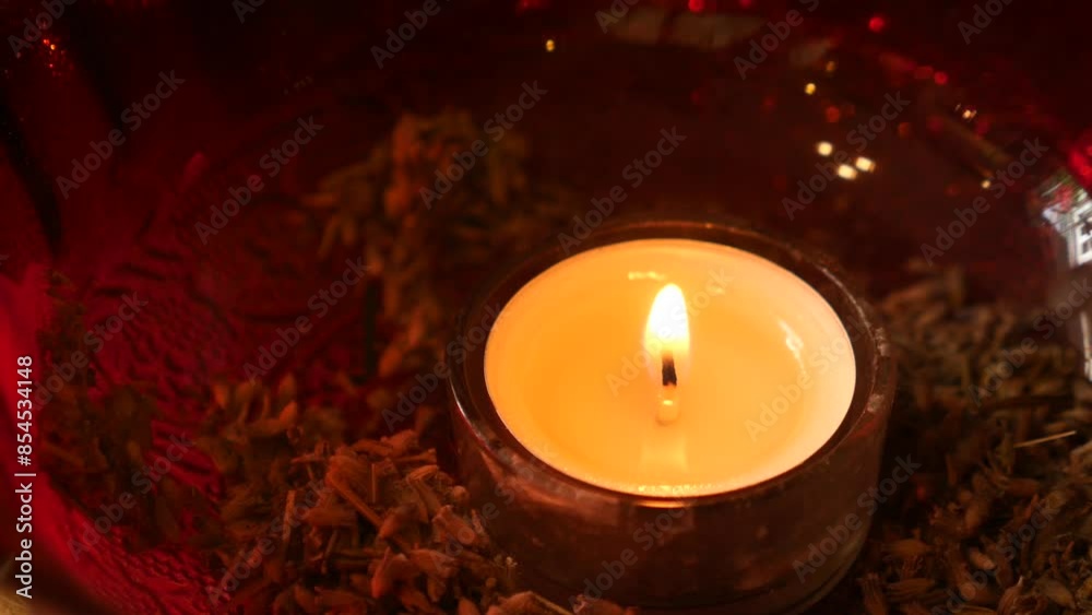 Create a warm and cozy ambiance with candlelight and potpourri in a red glass bowl Create a warm and cozy ambiance with candlelight and potpourri in a red glass bowl