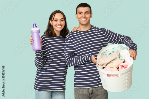 Young couple with laundry b...