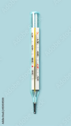 Mercury-in-glass thermometer with temperature mark 39 C on blue background flat lay vertical stopmotion animation slow motion video 4k photo