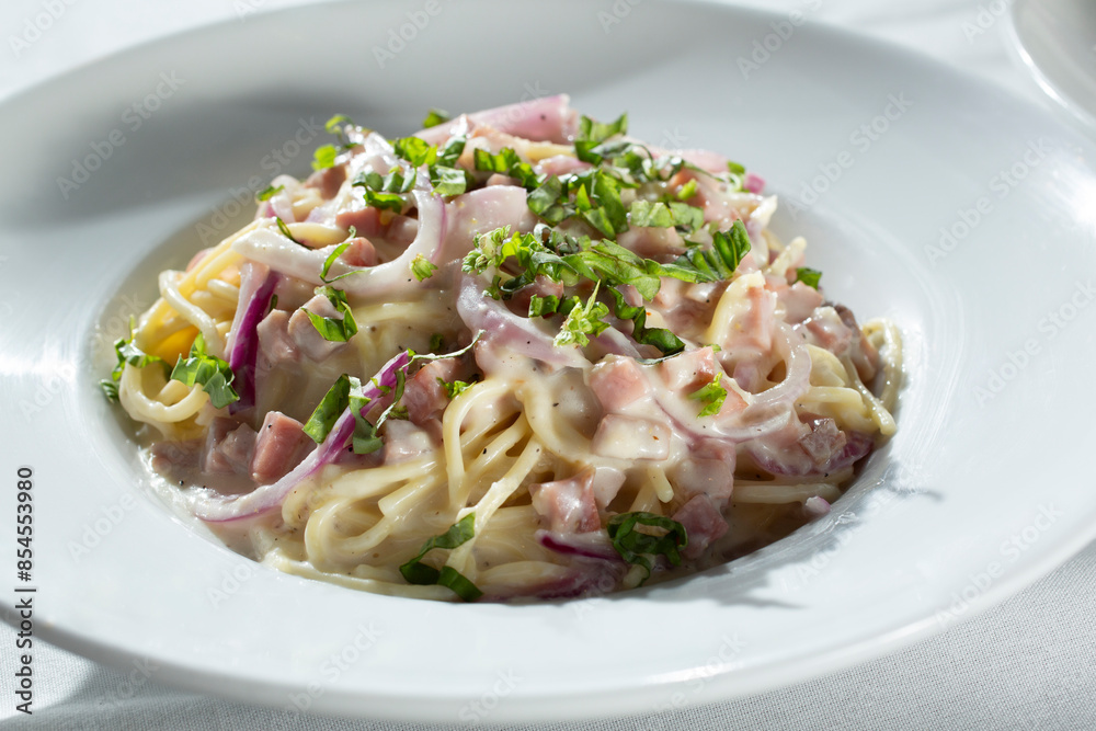 A view of a pasta carbonara plate. A view of a pasta carbonara plate.
