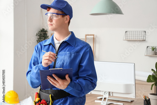 Thoughtful male electrician...