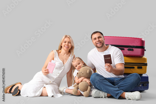 Happy family sitting with s...