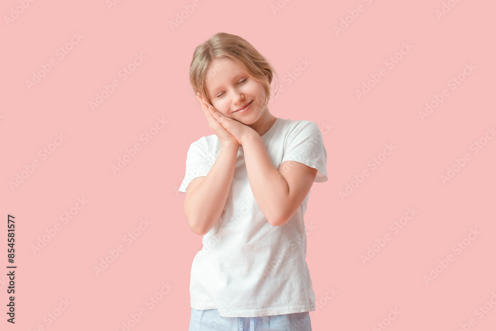 Adorable girl in cozy pajamas on pink background Adorable girl in cozy pajamas on pink background