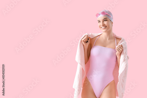Female swimmer with towel o...