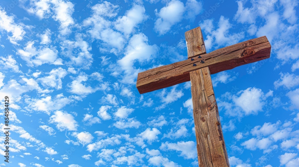 Upward view of a wooden Christian cross, blue sky with scattered clouds, representing faith and spirituality, peaceful and inspiring Upward view of a wooden Christian cross, blue sky with scattered clouds, representing faith and spirituality, peaceful and inspiring