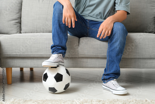 Teenage boy with soccer bal...