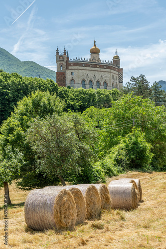 Hay bales near the ancient Rocchetta Mattei, Grizzana Morandi, Italy photo