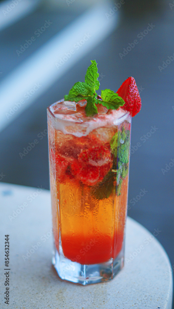 colorful cocktail with strawberry garnish colorful cocktail with strawberry garnish