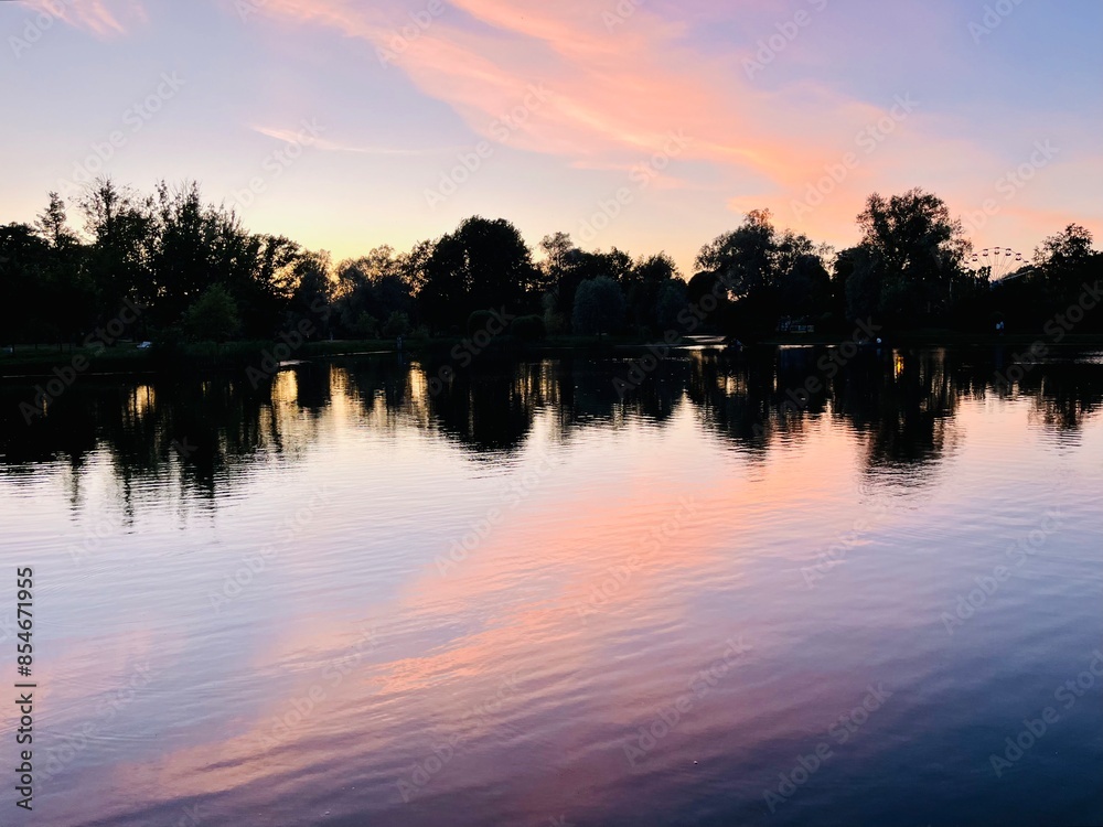 purple sky reflection on the lake surface, trees silhouettes reflection, twilights lake in the park purple sky reflection on the lake surface, trees silhouettes reflection, twilights lake in the park
