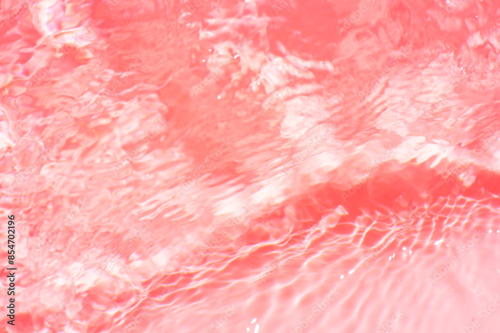 Pink water bubbles on the surface ripples. Defocus blurred transparent pink colored clear calm water surface texture with splash and bubbles. Water waves with shining pattern texture background Pink water bubbles on the surface ripples. Defocus blurred transparent pink colored clear calm water surface texture with splash and bubbles. Water waves with shining pattern texture background