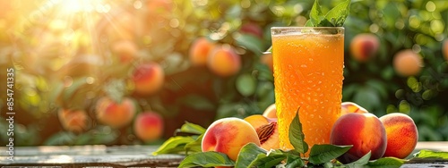 freshly squeezed peach juice on the background of the garden. Selective focus photo