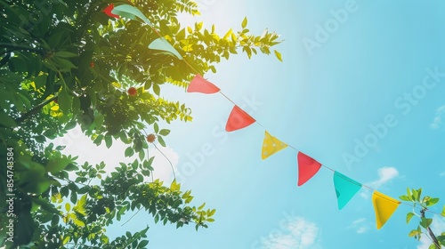 Colorful Bunting Flags Against a Bright Blue Sky