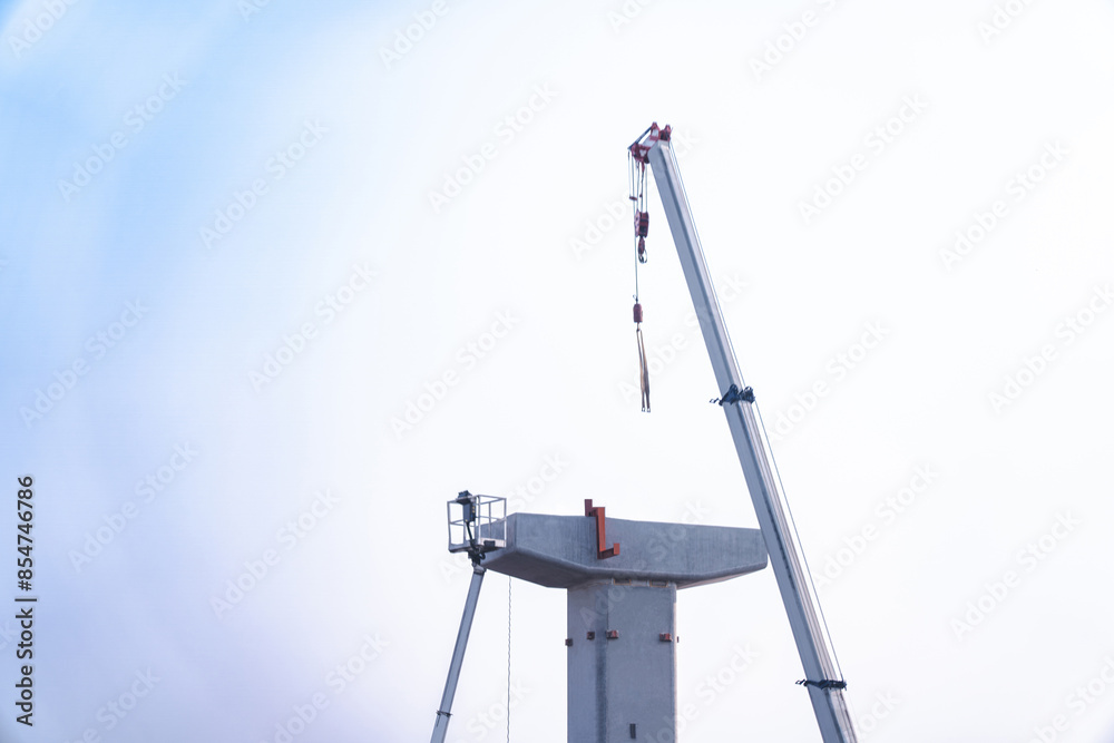 Construction of a bridge interchange ,Supporting elevated bridges Construction equipment crane at construction site Construction of a bridge interchange ,Supporting elevated bridges Construction equipment crane at construction site