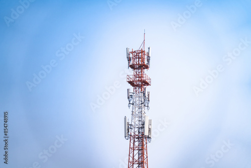 Telecommunications tower, transmitter, wireless communication antenna 5G cellular network, global connectivity In the background, the sky is bright