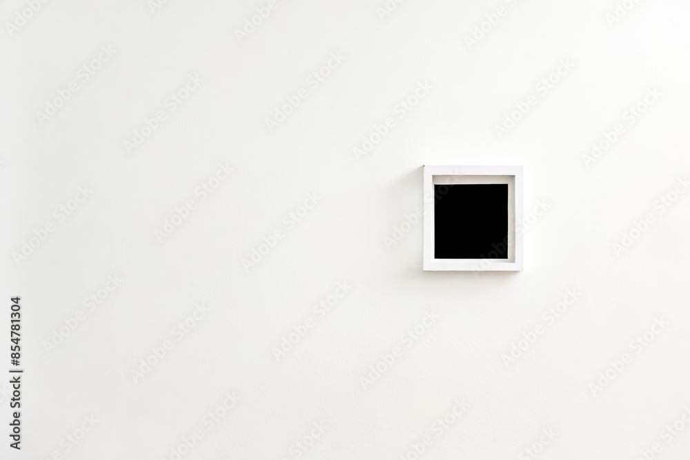 Minimalist White Wall With A Single Framed Picture Minimalist White Wall With A Single Framed Picture