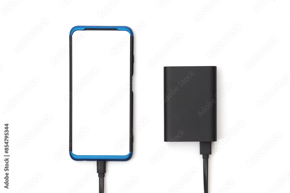 Smartphone and external battery for charging devices isolated on white. Top view Smartphone and external battery for charging devices isolated on white. Top view