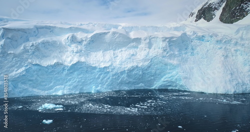 Valokuva Massive glacier iceberg towering cold polar ocean in Antarctica