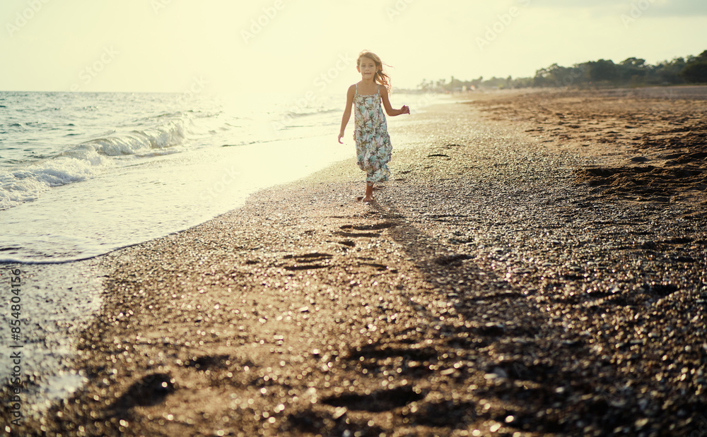 Happy liitle girl on the sea beach. Happy liitle girl on the sea beach.