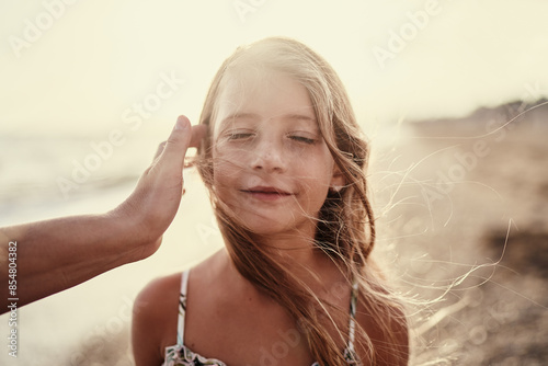 Happy liitle girl on the sea beach. photo