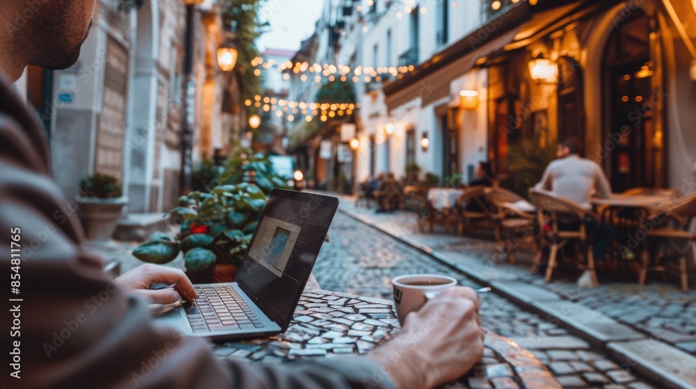 Serene Remote Worker: Typing on Laptop at Quaint European Café with Charming Architecture and Cobblestone Streets Serene Remote Worker: Typing on Laptop at Quaint European Café with Charming Architecture and Cobblestone Streets