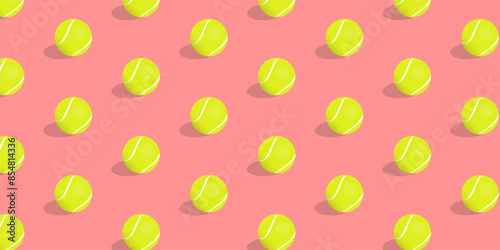 Tennis balls on a pink background, seamless pattern