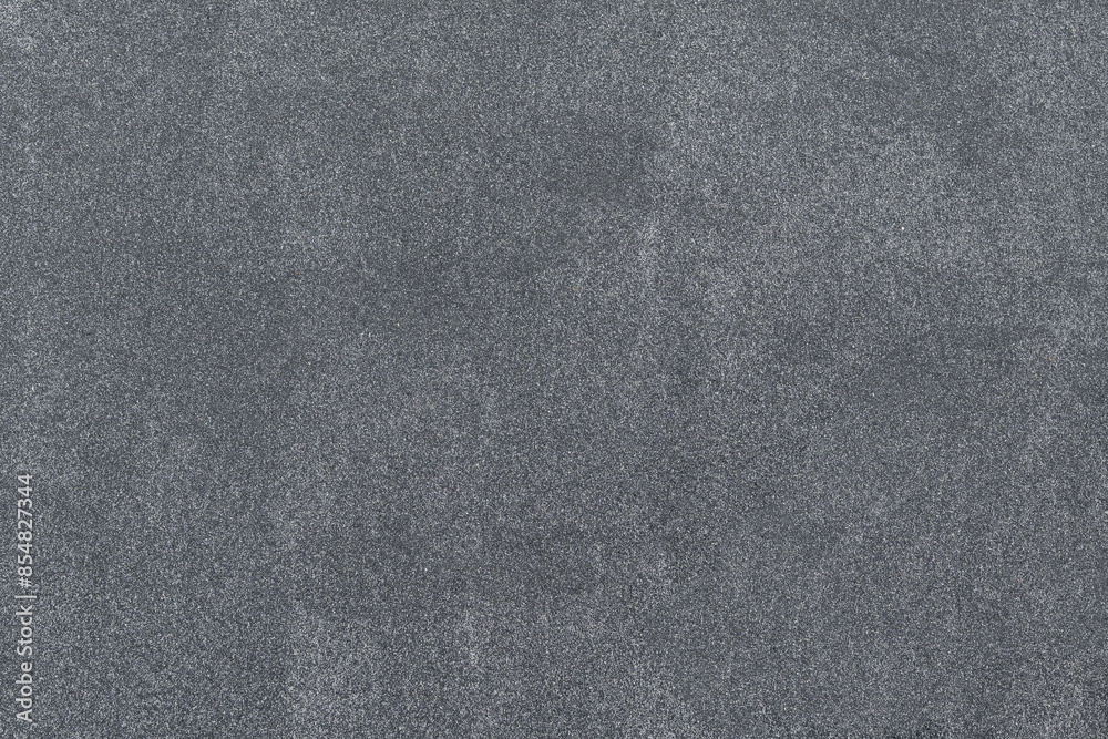 Fototapeta premium New asphalt texture. A frame filled with the textured surface of dry asphalt, showcasing the detailed pattern