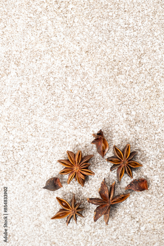 Spice star anise closeup on gray stone background, copy space for text Spice star anise closeup on gray stone background, copy space for text