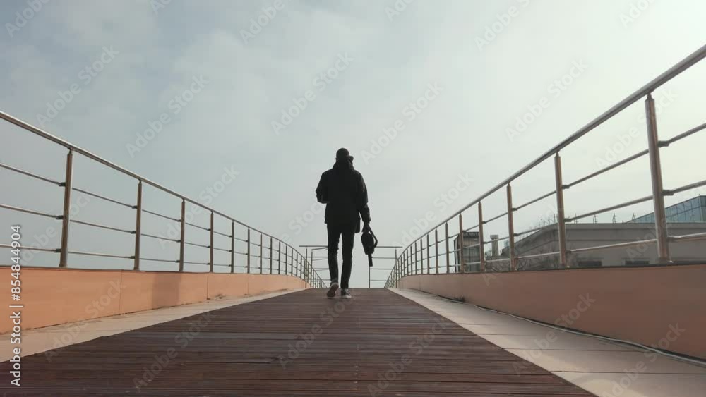 Entrepreneur walks up spacious modern stairway, slow motion, capturing a sense of progress and determination. Entrepreneur walks up spacious modern stairway, slow motion, capturing a sense of progress and determination.