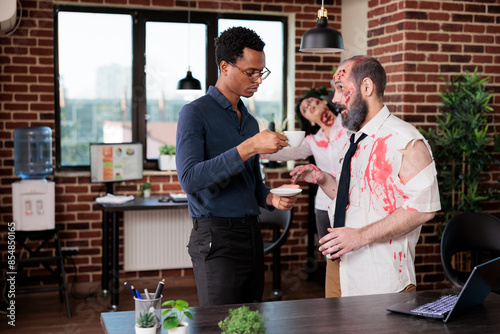 Fotografi Fatigued office workers stressed by overworking turning them into zombies, asking manager to lessen burden