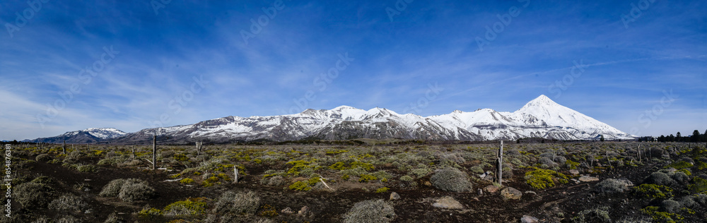 Panoramic view of the snow-capped Lanín Volcano in the Patagonian steppe of Argentina. Panoramic view of the snow-capped Lanín Volcano in the Patagonian steppe of Argentina.