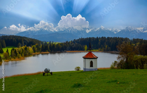 Chapel at Hegratsrieder See lake on an autumn morning, Ostallgäu, Bavaria, Germany photo