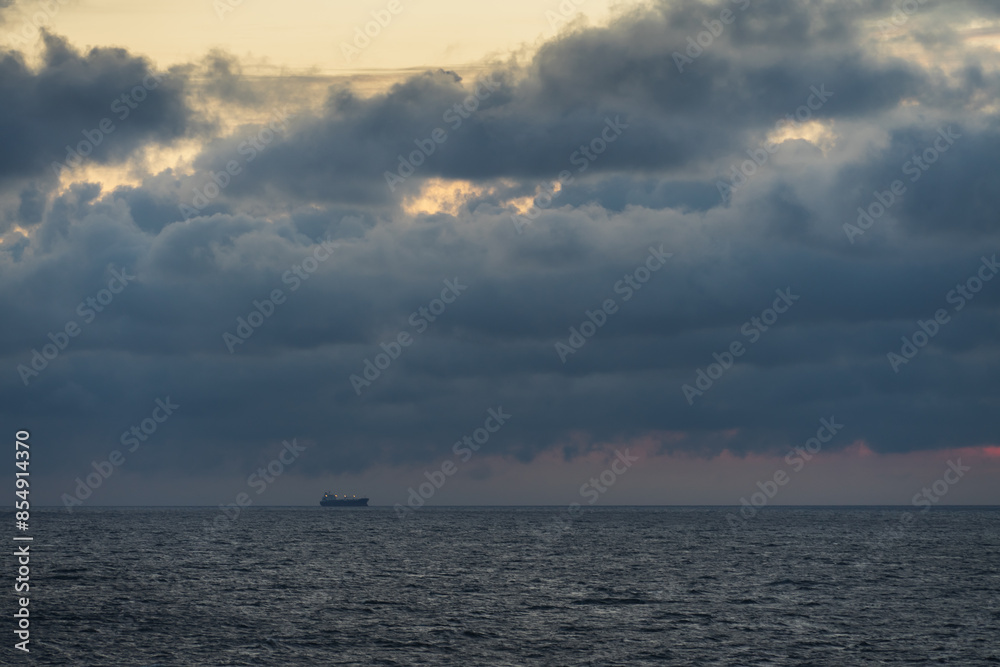 Cargo ship in the Baltic sea with thunderclouds. Cargo ship in the Baltic sea with thunderclouds.