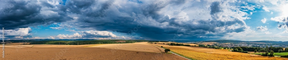 Dark thunderclouds over the fields and meadows in the Taunus Dark thunderclouds over the fields and meadows in the Taunus