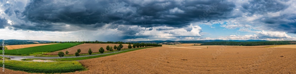 Dark thunderclouds over the fields and meadows in the Taunus Dark thunderclouds over the fields and meadows in the Taunus
