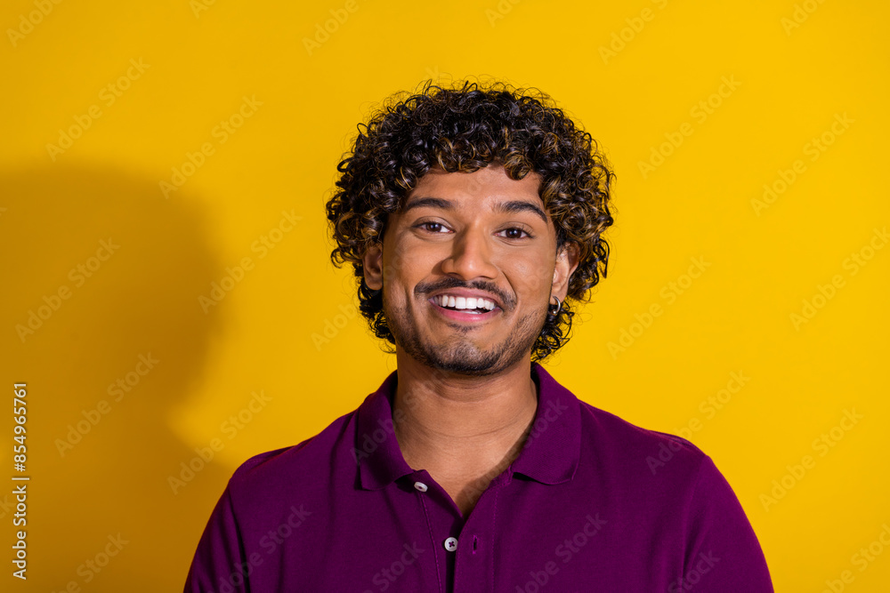 Photo portrait of attractive young man look camera dressed stylish violet clothes isolated on yellow color background Photo portrait of attractive young man look camera dressed stylish violet clothes isolated on yellow color background