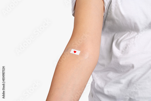 Blood donation. Blood donor with bandage after giving blood. Copy space