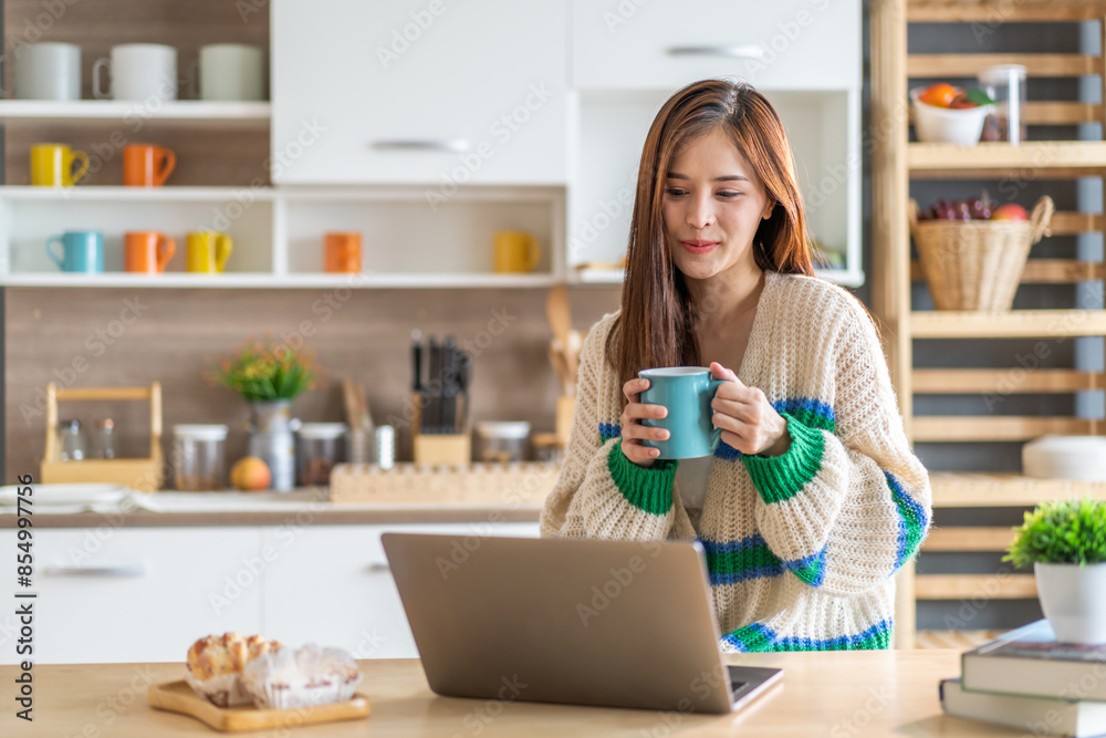 Young smiling asian woman relax using laptop conference work,learning education,study online,webinar podcast,creative woman looking at screen, shopping, online marketing at home Young smiling asian woman relax using laptop conference work,learning education,study online,webinar podcast,creative woman looking at screen, shopping, online marketing at home