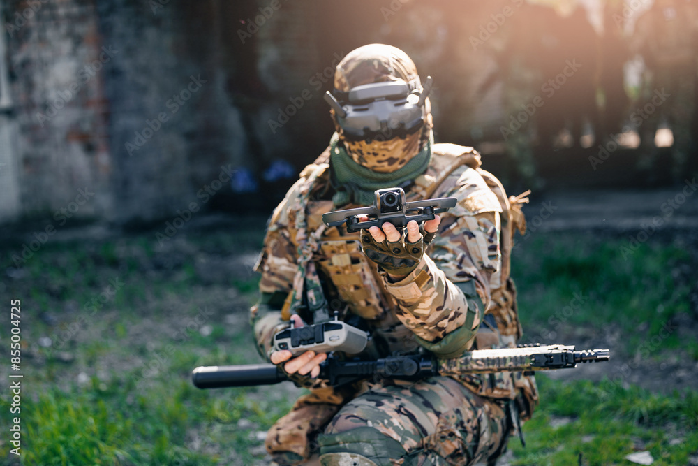 UAV Army operator in FPV glasses controls drone with bomb to drop into enemy fortifications and trenches UAV Army operator in FPV glasses controls drone with bomb to drop into enemy fortifications and trenches