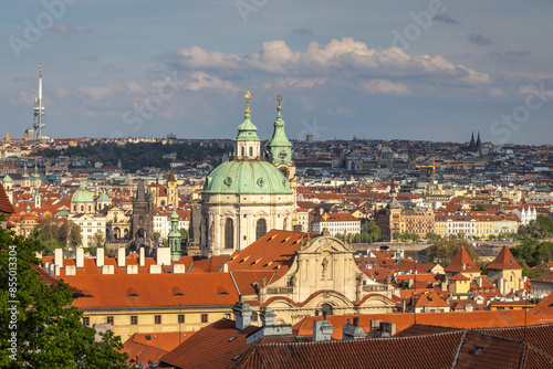 Cityscape view of the Lesser Town with the Church of Saint Nicholas in Prague at sunset, Czech Republic, Europe.
