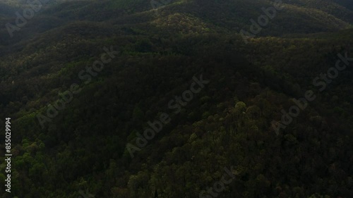 Aerial panning up to Looking Glass Rock in Blue Ridge Mountains North Carolina photo