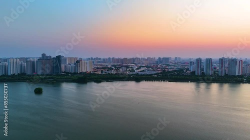Wallpaper Mural Aerial fly by at the riverfront of Linyi city during sunset. Shandong Province, China Torontodigital.ca
