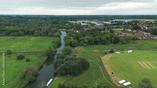 Aerial view of cricket field with beautiful landscape of Huntingdonshire, England during cloudy day. photo