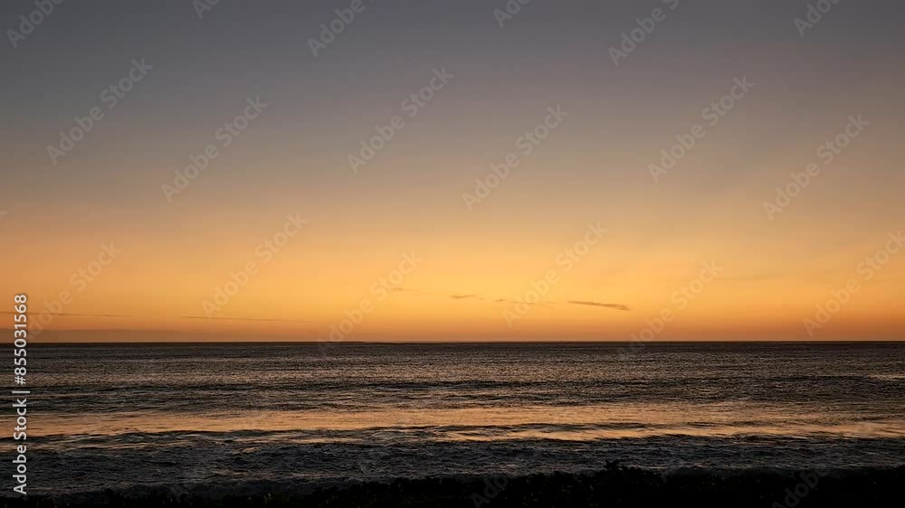 Stunning sunset at Natadola Beach, Fiji. The sky glows with warm orange and yellow hues as the sun sets over the calm ocean, with gentle waves lapping against the shore in a serene scene. Stunning sunset at Natadola Beach, Fiji. The sky glows with warm orange and yellow hues as the sun sets over the calm ocean, with gentle waves lapping against the shore in a serene scene.