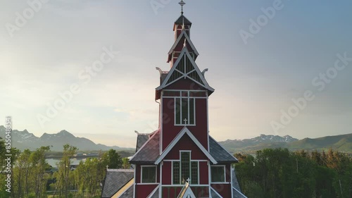Buksnes Church, Norway at sunset: Touring the pretty red church in Norway. photo