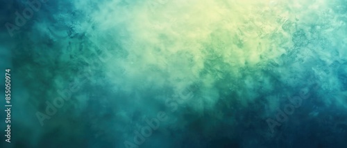Abstract texture featuring a gradient blend of teal, green and blue hues with a soft, dreamlike atmosphere. photo