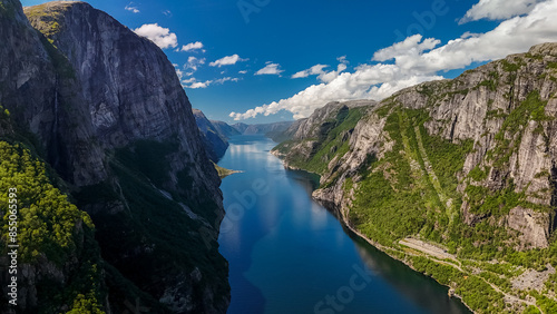 An aerial view of a fjord in Norway, showcasing towering cliffs and a winding waterway surrounded by lush greenery. Kjerag, Lysebotn, Lysefjorden, Norway photo