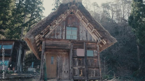 Wooden With Steep Thatched Roof House At Shirakawa-go Hamlet In Shirakawa, Japan. Tilt-up Shot