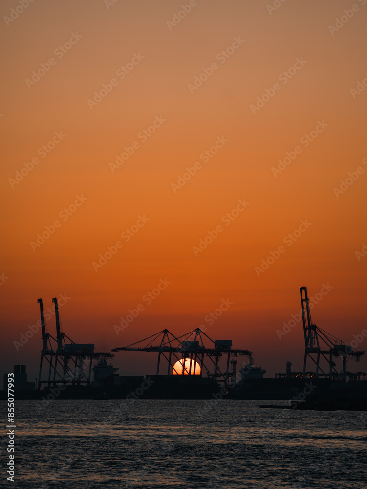 Efficient Harbor Logistics: Cargo Containers and Freight Ships Transported with Industry Cranes, A Vital Maritime Business at Sunset, Facilitating Import and Export Trade Across the Ocean Efficient Harbor Logistics: Cargo Containers and Freight Ships Transported with Industry Cranes, A Vital Maritime Business at Sunset, Facilitating Import and Export Trade Across the Ocean