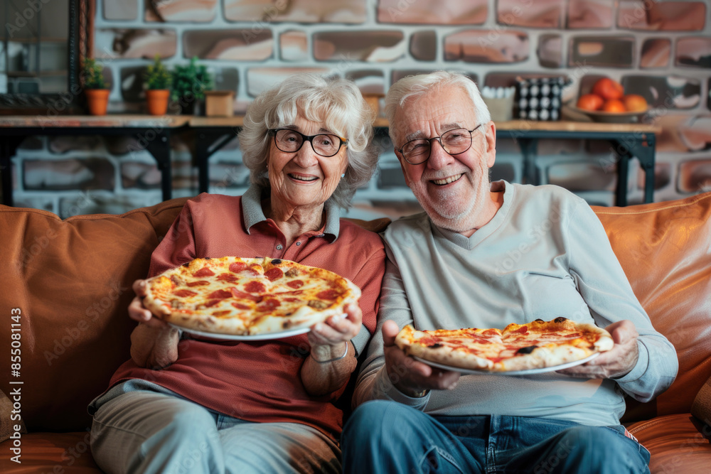 Portrait of happy senior couple eating pizza and enjoying evening at home Portrait of happy senior couple eating pizza and enjoying evening at home